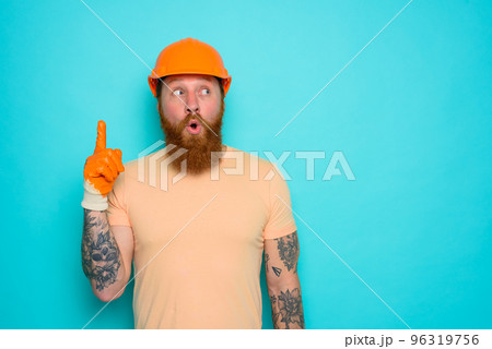 Incompetent worker with wondered expression indicates something 96319756