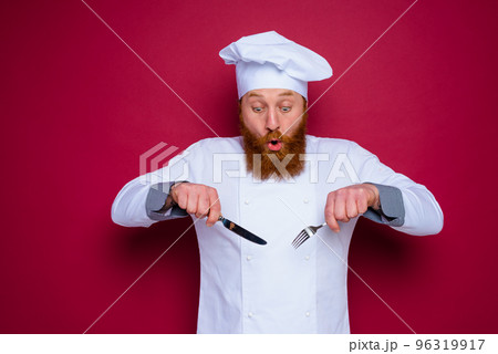 amazed chef with beard and red apron is ready to cook amazed chef with beard and red apron is ready to cook 96319917
