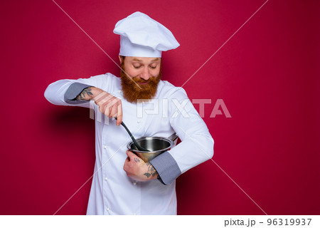 Happy chef with beard and red apron is ready to cook Happy chef with beard and red apron is ready to cook 96319937