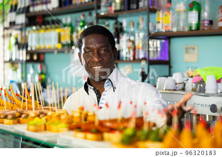 View on the adult African man at the food display 96320183