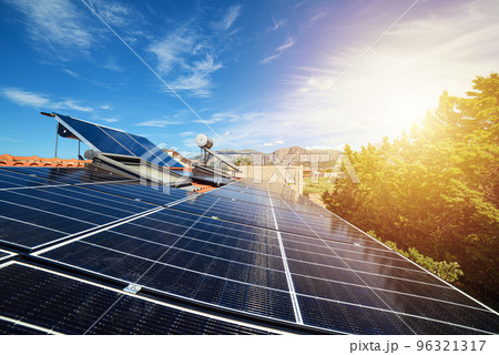 Renewable energy system with solar panel for electricity and hot water 96321317