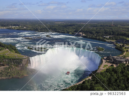 Aerial view of Horseshoe Falls including Hornblower Boat sailing on Niagara River, Canada and USA natural border 96322563