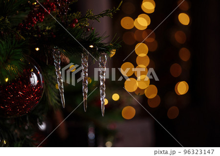 Decorated branch of a Christmas tree on a blurred background. 96323147