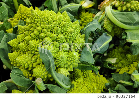 Stack of romanesco broccolis on a market stall 96327164