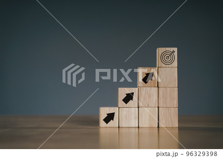 Pile of wooden cube block stack as stair step on wood table. Success, climbing to the top, Progression, business growth concept. Pile of wooden cube block stack as stair step on wood table. Success, climbing to the top, Progression, business growth concept. 96329398