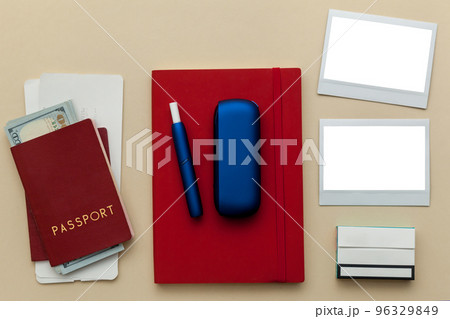 Iqos electronic blue cigarette on a beige background. Iqos electronic blue cigarette on a beige background. 96329849