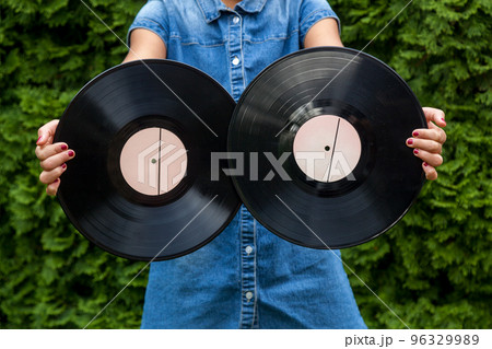 child girl holds vinyl records child girl holds vinyl records 96329989