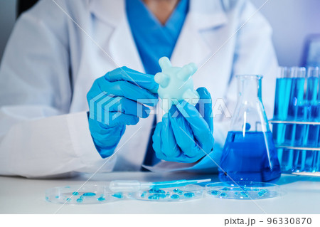 Female biotechnologist testing new chemical substances in a laboratory.. Female biotechnologist testing new chemical substances in a laboratory.. 96330870