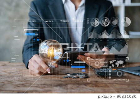 business hand showing creative business strategy with light bulb as concept business hand showing creative business strategy with light bulb as concept 96331030