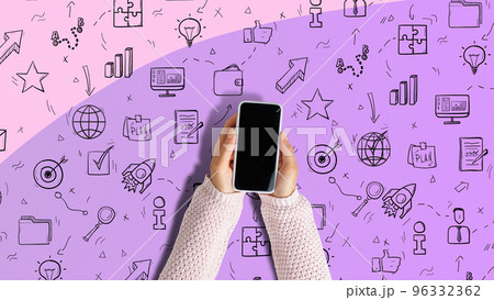 Smartphone in the hands of a person. Various icons as symbols of programs to use. Smartphone in the hands of a person. Various icons as symbols of programs to use. 96332362