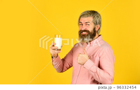 man is drinking fresh glass of milk. agriculture industry and farming. Drink milk for health. Milkman. food store department. World milk day. warm milk from cold and flu man is drinking fresh glass of milk. agriculture industry and farming. Drink milk for health. Milkman. food store department. World milk day. warm milk from cold and flu 96332454