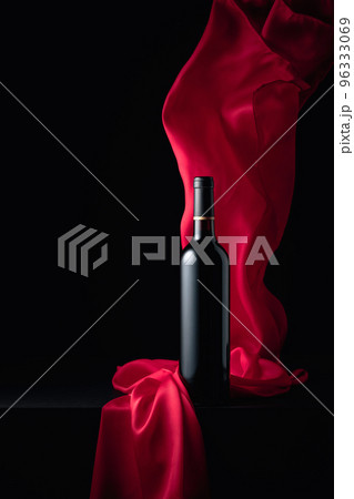 Bottle of red wine with flutters red cloth. Bottle of red wine with flutters red cloth. 96333069