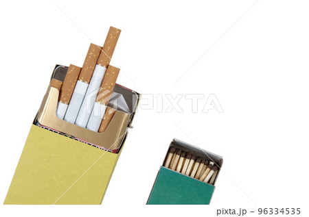 Yellow pack of cigarettes and green matchbox isolated on white background with clipping path 96334535