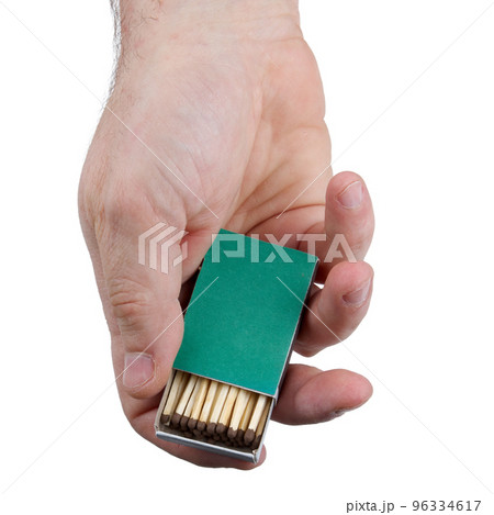 Close up o fhuman hands with open green matchbox isolated on white background with clipping path Close up o fhuman hands with open green matchbox isolated on white background with clipping path 96334617