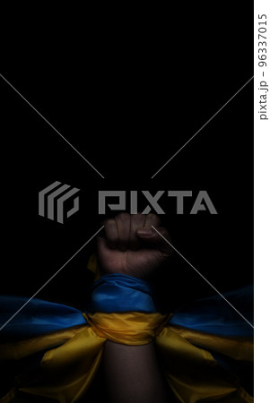 Russian flag and Ukrainian flag on a black background. Russian flag and Ukraine flag in hands showing symbol of struggle war political struggle political expressions Civil wars and territory conflict. 96337015