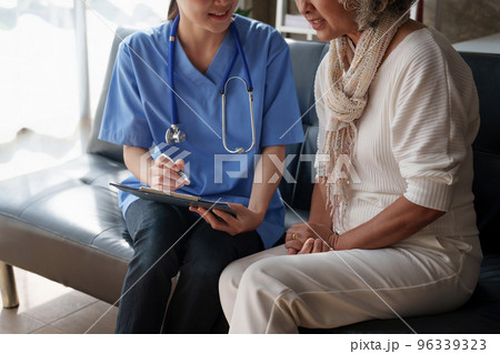 Home healthcare nurse, physical therapy with senior adult woman at home Home healthcare nurse, physical therapy with senior adult woman at home 96339323