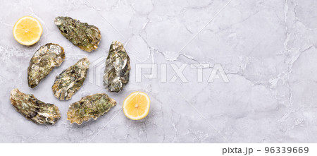 Fresh oysters and lemons Fresh oysters and lemons 96339669