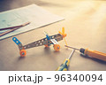 Toy iron plane with screwdrivers. Metal constructor. Dream, play and create 96340094