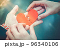 Male and female hands repairing a broken heart. Divorce concept. Love concept 96340106