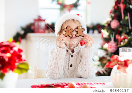 Family baking Christmas cookies. Kids Xmas fun. Family baking Christmas cookies. Kids Xmas fun. 96340157