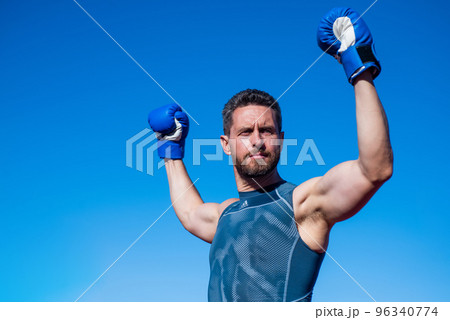 man boxer on stadium. fitness gym outdoor. muscular athletic guy training in boxing gloves. sport success. male fitness sportswear. sportsman on sky background. mature handsome athlete man boxer on stadium. fitness gym outdoor. muscular athletic guy training in boxing gloves. sport success. male fitness sportswear. sportsman on sky background. mature handsome athlete 96340774