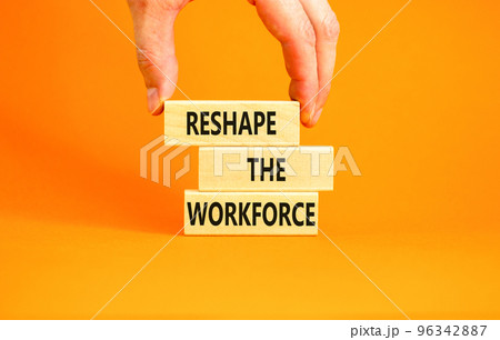 Reshape the workforce and support symbol. Concept words Reshape the workforce on wooden blocks. Businessman hand. Beautiful orange background. Business reshape the workforce quote concept. Copy space 96342887