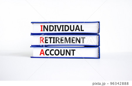 IRA individual retirement account symbol. Concept words IRA individual retirement account on books on beautiful white background. Business IRA individual retirement account concept. Copy space IRA individual retirement account symbol. Concept words IRA individual retirement account on books on beautiful white background. Business IRA individual retirement account concept. Copy space 96342888