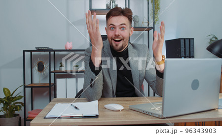 Happy amazed businessman shocked by sudden victory, game winning, lottery goal achievemen, good news 96343903