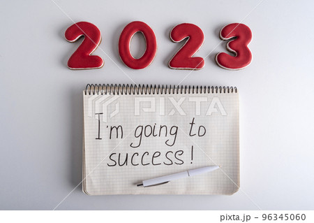 Numbers 2023 and notebook with the words I am going to success. Motivation for 2023. 96345060