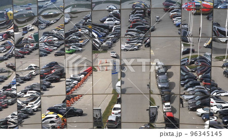 Reflection in the glasses of a modern shopping center building 96345145