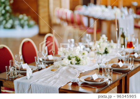 Beautiful table setting for a party, wedding reception or other festive event. Banquet setting, glasses, plates. 96345905