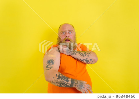 Amazed man with beard and tattoos did the vaccine against covid-19 96348460
