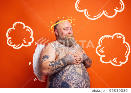 Fat man with beard ,tattoos and wings acts like an angel Fat man with beard ,tattoos and wings acts like an angel 96350086