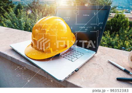 Laptop of a architect who plans a house Laptop of a architect who plans a house 96352383