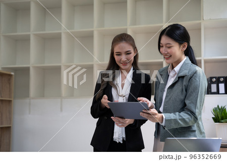 diverse coworkers working together in boardroom, brainstorming, discussing and analyzing and planning business strategy. 96352669