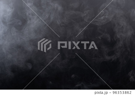 Dense Fluffy Puffs of White Smoke and Fog on black Background, Abstract Smoke Clouds, Movement Blurred out of focus. Smoking blows from machine dry ice fly fluttering in Air, effect texture 96353862