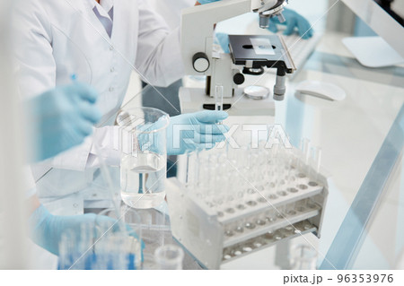 scientists conduct testing in a medical laboratory . scientists conduct testing in a medical laboratory . 96353976
