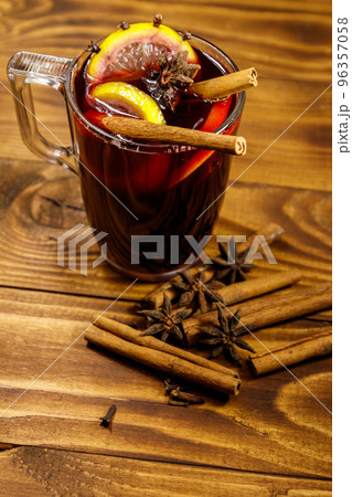 Mulled wine and spices on wooden table Mulled wine and spices on wooden table 96357058