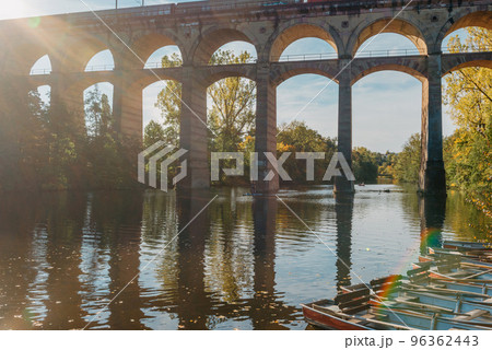 Railway Bridge with river in Bietigheim-Bissingen, Germany. Autumn. Railway viaduct over the Enz River, built in 1853 by Karl von Etzel on a sunny summer day. Bietigheim-Bissingen, Germany. Old Railway Bridge with river in Bietigheim-Bissingen, Germany. Autumn. Railway viaduct over the Enz River, built in 1853 by Karl von Etzel on a sunny summer day. Bietigheim-Bissingen, Germany. Old 96362443