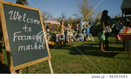People shopping on urban farmers market 96365693