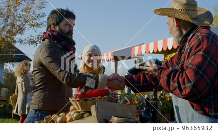 Spouses shopping on local farmers market Spouses shopping on local farmers market 96365932