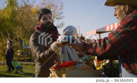 Couple shopping at local farmers market Couple shopping at local farmers market 96366005