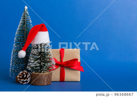 Christmas composition. craft Gift box, small tree, branches and craft DIY decorations on white background. New year concept. Christmas home decoration Flat lay, top view, copy space 96368667