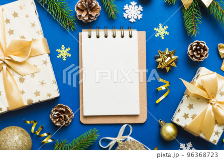 Christmas blank greeting card mock-up scene. Creative layout made of Christmas tree branches and paper card note. Flat lay. Nature New Year concept 96368723