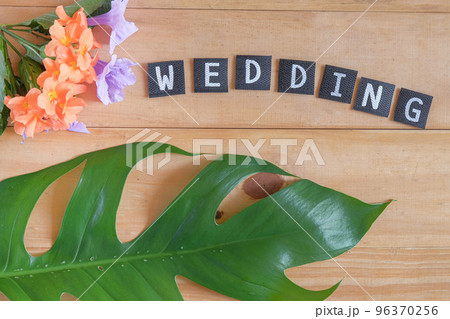 Wedding text on wood table , love concept. Wedding text on wood table , love concept. 96370256