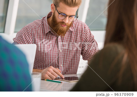 Businessman works in office with a tablet connected on internet 96370909