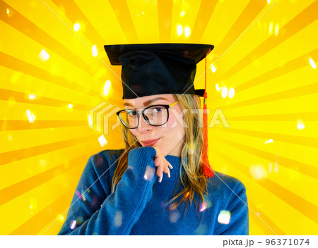 Woman is happy to have achieved graduation and success in studies Woman is happy to have achieved graduation and success in studies 96371074