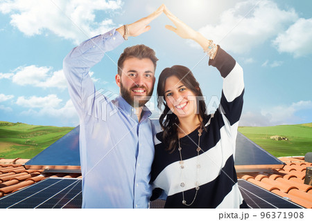 Family uses renewable energy system with solar panel Family uses renewable energy system with solar panel 96371908