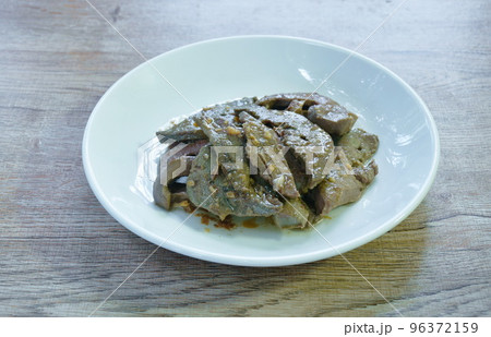 fried slice pork liver with garlic and pepper on plate fried slice pork liver with garlic and pepper on plate 96372159