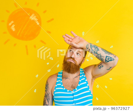 Man in swimsuit sweats due to too hot Man in swimsuit sweats due to too hot 96372927